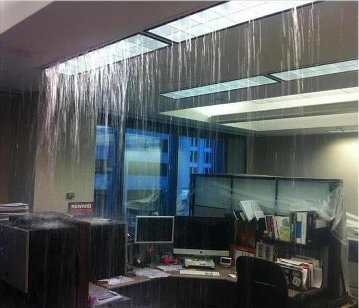 Office space with ice forming and water flowing from the ceiling 