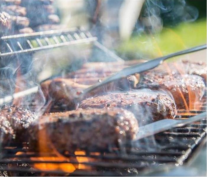 close up of food cooking on an outdoor grill