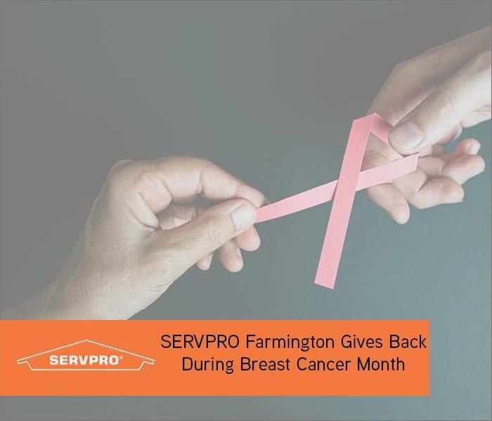 Pink ribbon with orange text and SERVPRO logo